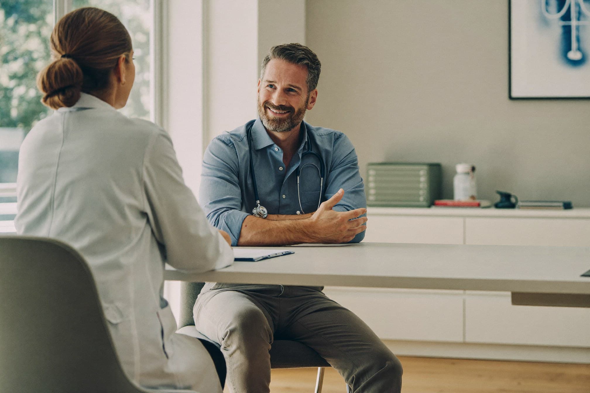Physician talking with a patient during an initial consultation